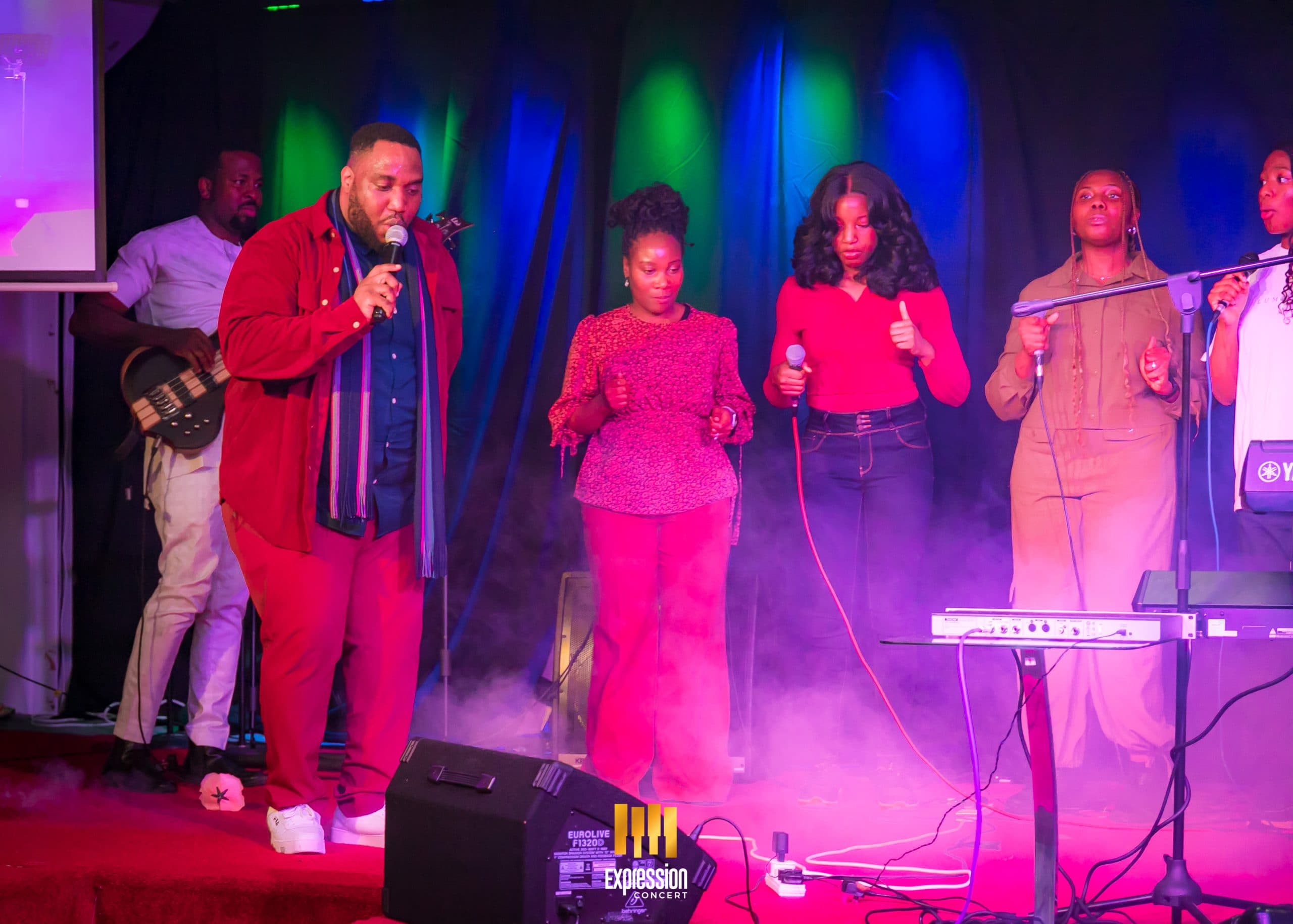 Singers performing on stage at Expression Concert